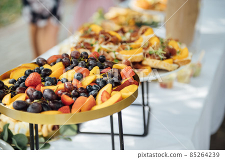 Wedding cake table background. Sweet and delicious restaurant desserts. Tasty food on buffet party. 85264239