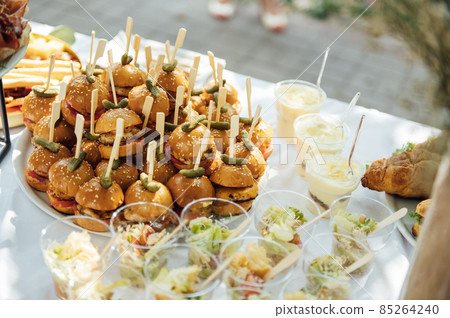 Wedding cake table background. Sweet and delicious restaurant desserts. Tasty food on buffet party. 85264240