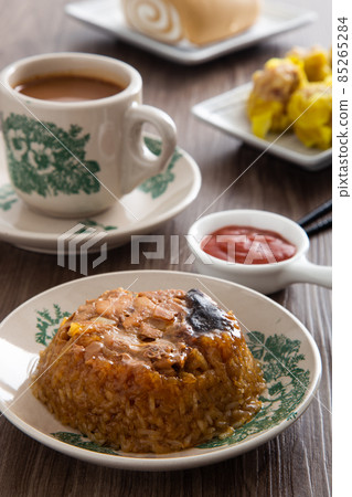 Dim Sum Loh Mai Kai. Steamed Glutinous Rice with chicken mushrooms and sausage 85265284