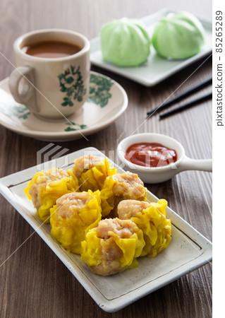 Siu Mai - Chinese steamed pork dumplings in bamboo steamers. Dim Sum 85265289