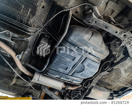 Lifting car engine and suspension system awaiting maintenance in garage Lifting car engine and suspension system awaiting maintenance in garage 85268729