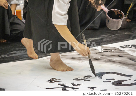 High school girl doing calligraphy performance High school girl doing calligraphy performance 85270201