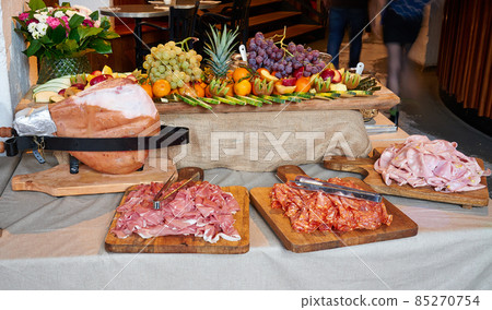 Colored buffet with seasonal fresh fruits and different kind of Ham 85270754