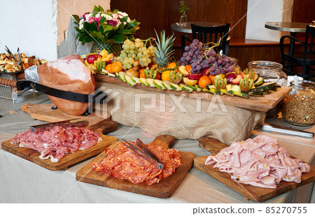 Colored buffet with seasonal fresh fruits and different kind of Ham 85270755