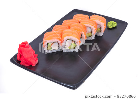 Japanese seafood Sushi roll isolated on white close up. Japanese food restaurant, sushi maki gunkan roll plate or platter set. Maki Sushi rolls with salmon and avocado. Sushi isolated at white 85270866
