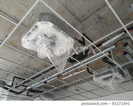 SELANGOR, MALAYSIA -MARCH 5, 2021: Installation of ceiling cassette air-condition units. Mounted on the ceiling, and has the ability to cool the space more efficiently. 85271841