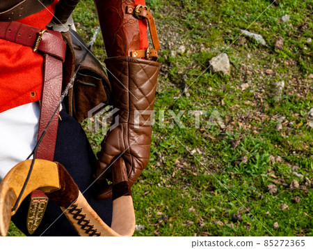 man in medieval dress with hand with leather glove holding a composite bow man in medieval dress with hand with leather glove holding a composite bow 85272365