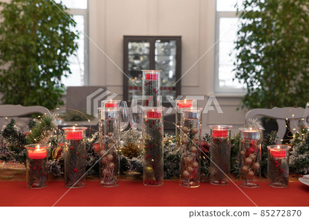Beautiful table setting with Christmas decorations. Red colors Beautiful table setting with Christmas decorations. Red colors 85272870