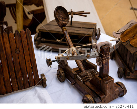 small wooden catapult model, miniature reproduction of medieval siege weapon small wooden catapult model, miniature reproduction of medieval siege weapon 85273411