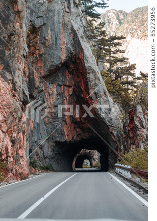 Empty route and small tunnel in mountain 85273956