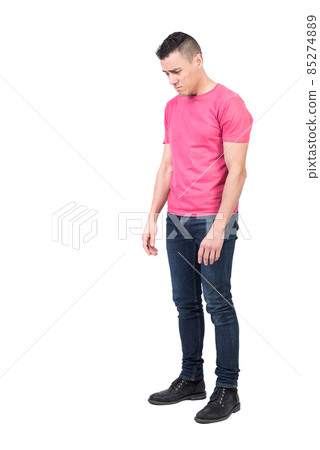 Discontent man standing in studio. White background 85274889