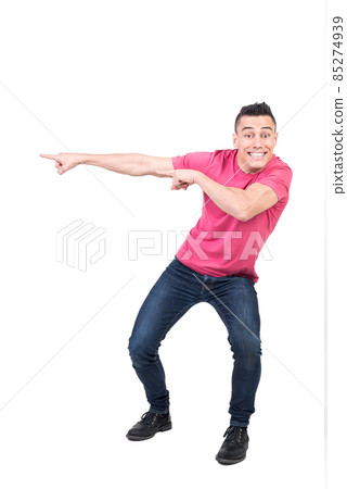 Delighted man pointing aside in studio. White background 85274939