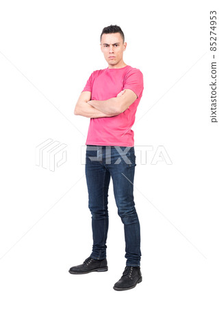 Confident man with folded hands in studio 85274953