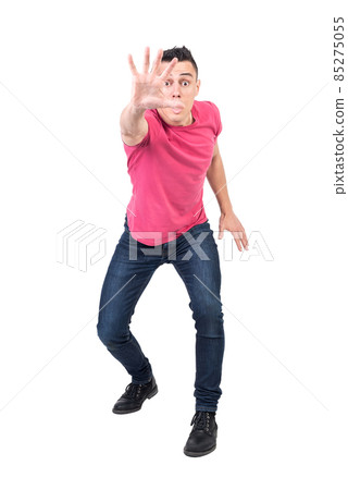 Worried man showing stop gesture to camera Worried man showing stop gesture to camera 85275055