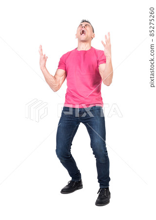 Despaired young guy shouting with closed eyes 85275260