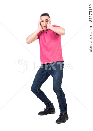 Scared man touching head and looking at camera 85275329