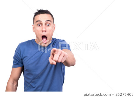 Man pointing while opening the mouth with surprised expression Man pointing while opening the mouth with surprised expression 85275403