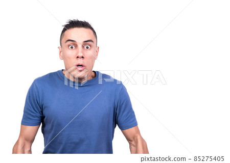 Man with shocked expression looking at the camera Man with shocked expression looking at the camera 85275405