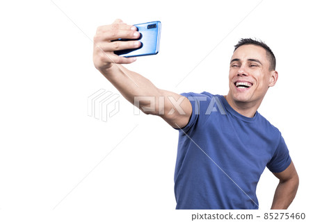 Man taking a selfie while laughing to the camera 85275460
