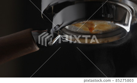 pull espresso shot with bottomless portafilter on a professional coffee machine pull espresso shot with bottomless portafilter on a professional coffee machine 85275803