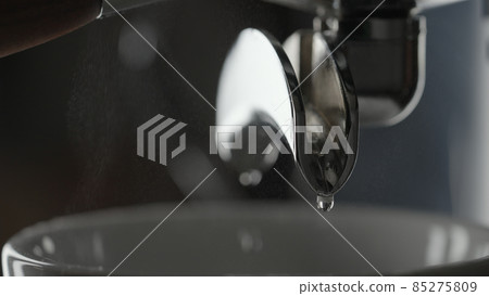 rinsing coffee machine with double spout portafilter closeup rinsing coffee machine with double spout portafilter closeup 85275809