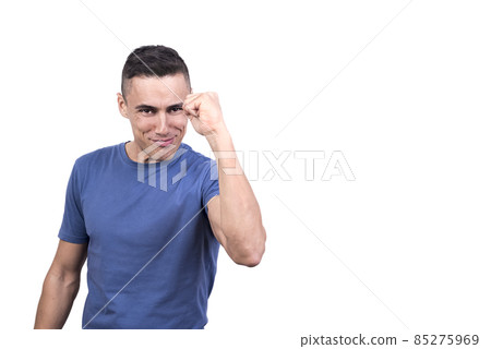 Proud man celebrating while raising one arm Proud man celebrating while raising one arm 85275969