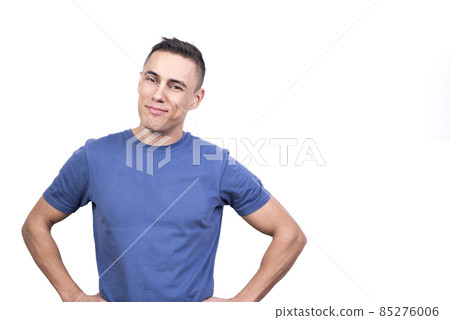 Man smiling relaxed with his hands on hip Man smiling relaxed with his hands on hip 85276006