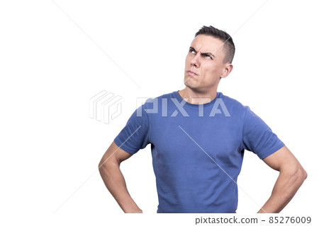 Man looking up with expression of doubt while thinking Man looking up with expression of doubt while thinking 85276009