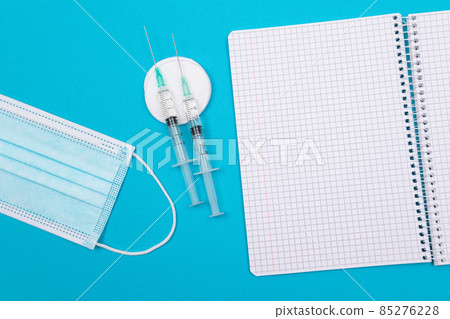 Vaccination or Revaccination Concept - Three Insulin Syringe on Blue Table Vaccination or Revaccination Concept - Three Insulin Syringe on Blue Table 85276228