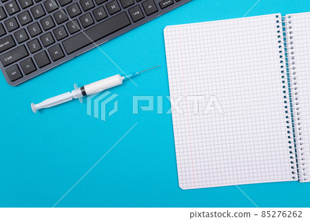 Vaccination or Revaccination Concept - Three Insulin Syringe on Blue Table 85276262