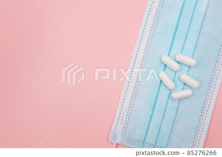 White Pills or Tablets on Medical Face Mask 85276266