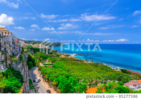 Tropea town cityscape with Camping Marina dell'Isola and green trees in park, colorful buildings on rock cliff Tropea town cityscape with Camping Marina dell'Isola and green trees in park, colorful buildings on rock cliff 85277386