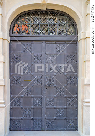 Old dark forged door with lock 85277453