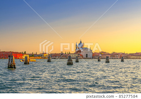 Chiesa del Santissimo Redentore catholic church and row of buildings on fondamenta embankment of Giudecca island Chiesa del Santissimo Redentore catholic church and row of buildings on fondamenta embankment of Giudecca island 85277584