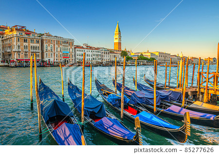 Gondolas moored in water of Grand Canal waterway in Venice 85277626