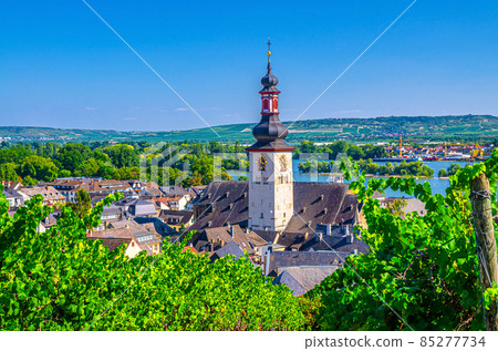 Aerial view of Rudesheim am Rhein historical town centre with clock tower spire of St. Jakobus catholic church 85277734