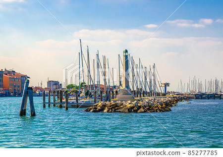 Lighthouse on stone pier of yacht port marina Lighthouse on stone pier of yacht port marina 85277785