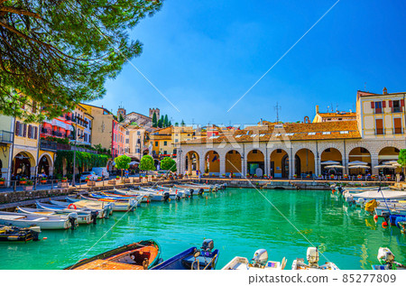Old harbour Porto Vecchio with motor boats on turquoise water 85277809