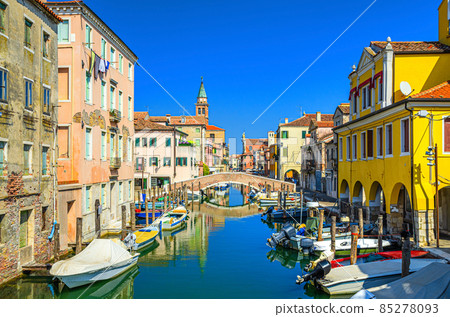 Chioggia cityscape with narrow water canal Vena with moored multicolored boats Chioggia cityscape with narrow water canal Vena with moored multicolored boats 85278093