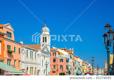Chiesa di San Francesco catholic church and row of colorful multicolored buildings in Chioggia Chiesa di San Francesco catholic church and row of colorful multicolored buildings in Chioggia 85278095