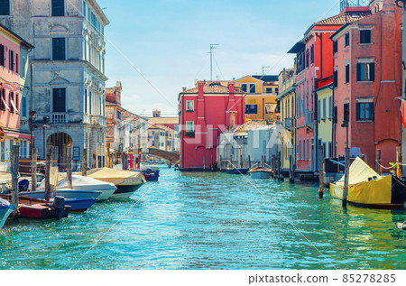 Chioggia cityscape with narrow water canal Vena with moored multicolored boats Chioggia cityscape with narrow water canal Vena with moored multicolored boats 85278285