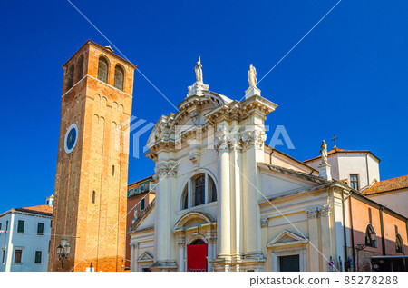 Chiesa Saint Andrea catholic church building with brick bell tower in historical centre of Chioggia Chiesa Saint Andrea catholic church building with brick bell tower in historical centre of Chioggia 85278288