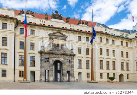 Matthias Gate of New Royal Palace Novy kralovsky palac and EU and Czech flags at flagpole 85278344