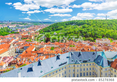 Top aerial panoramic view of Prague historical city centre with red tiled roof buildings Top aerial panoramic view of Prague historical city centre with red tiled roof buildings 85278368