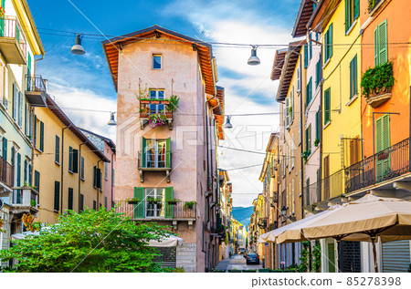 Traditional colorful building with balconies, shutter windows and multicolored walls 85278398
