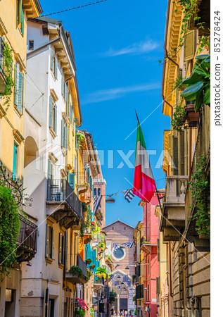 Typical italian street with traditional colorful buildings with shutter windows Typical italian street with traditional colorful buildings with shutter windows 85278424