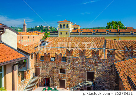 Teatro Nuovo theatre courtyard, brick wall with merlons and red tiled roof Teatro Nuovo theatre courtyard, brick wall with merlons and red tiled roof 85278431