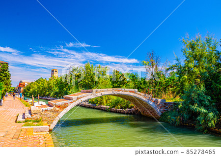 Stone Devil bridge across water canal on Torcello island Stone Devil bridge across water canal on Torcello island 85278465