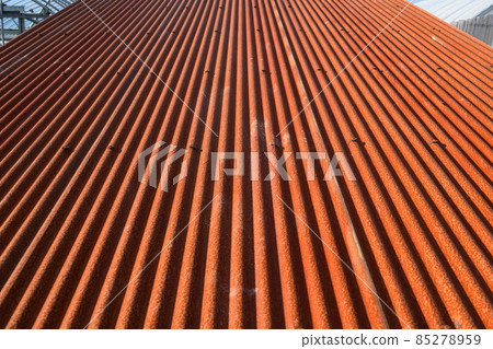 Reddish brown rusted corrugated iron 85278959