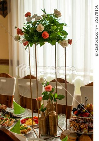 Bouquet of flowers standing on the flower stand Bouquet of flowers standing on the flower stand 85279156